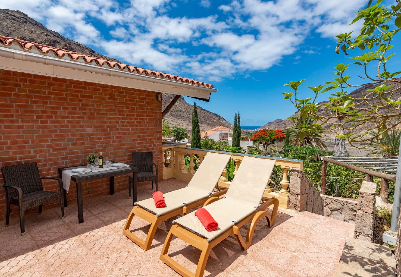Huis in Mogán - GC0283 Vakantiehuis met gedeeld zwembad in Mogán