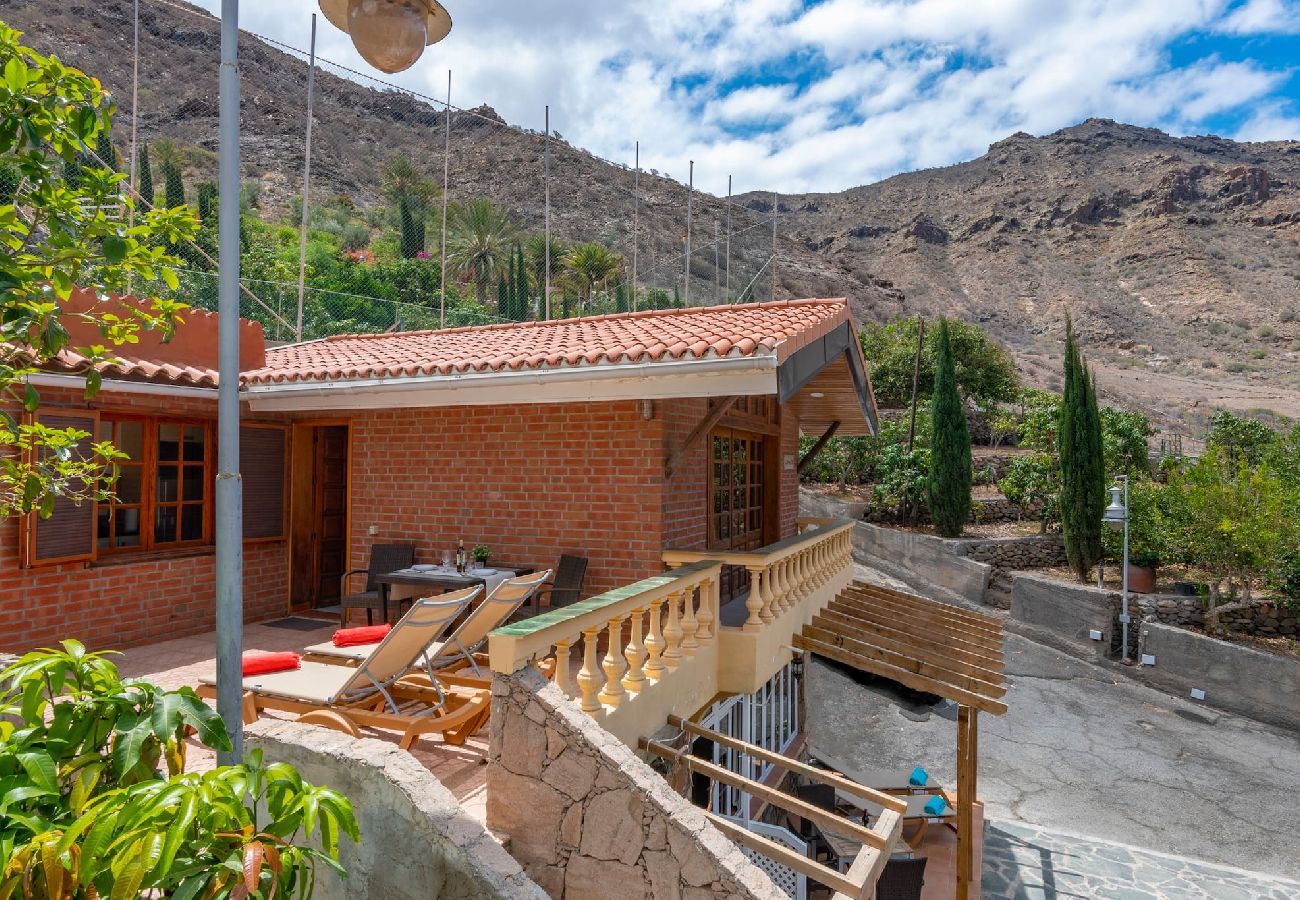 Huis in Mogán - GC0283 Vakantiehuis met gedeeld zwembad in Mogán
