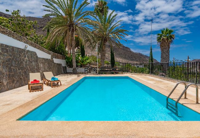 Huis in Mogán - GC0282 Vakantiehuis met gedeeld zwembad in Mogán