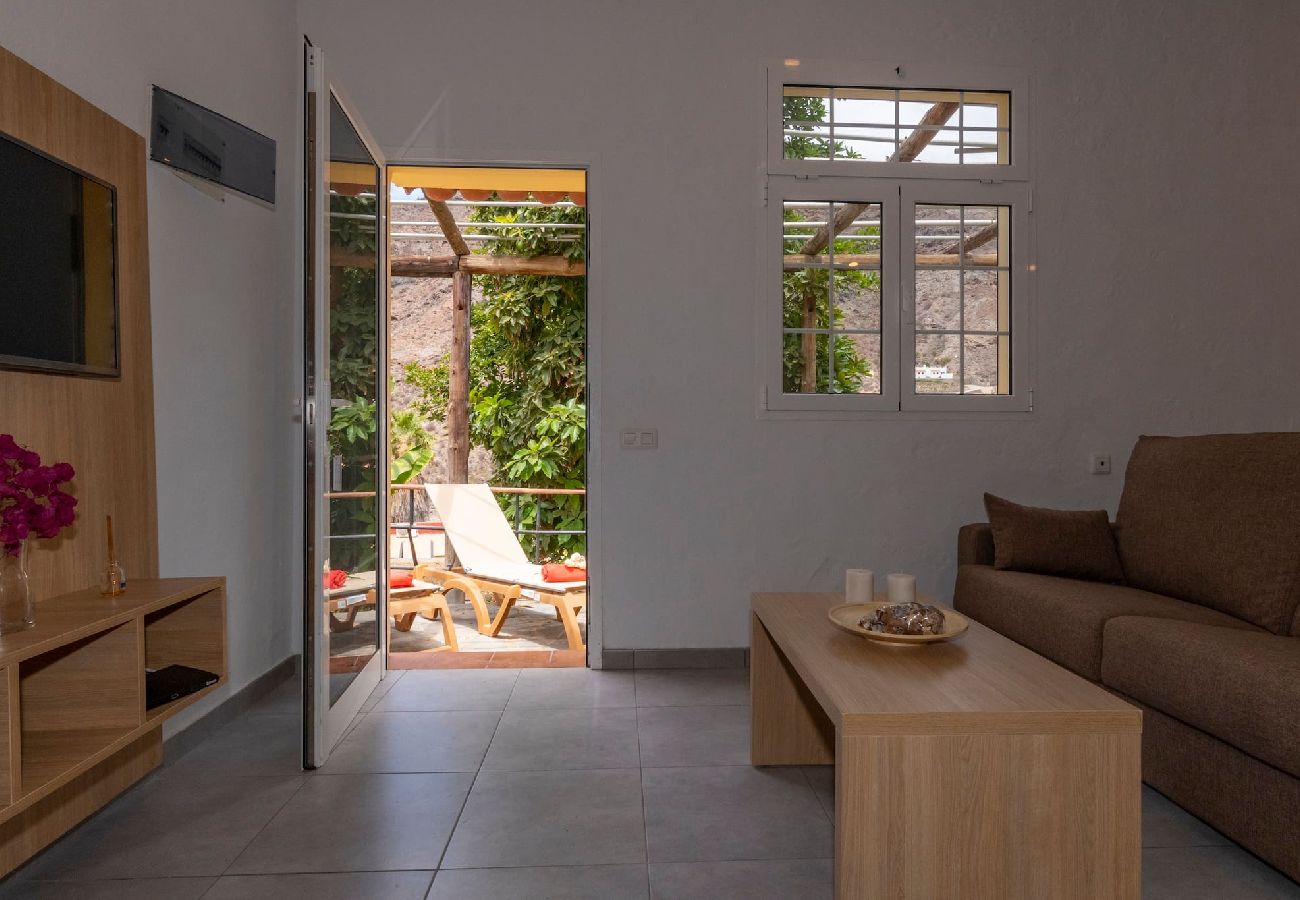 Huis in Mogán - GC0284 Vakantiehuis met gedeeld zwembad in Mogán