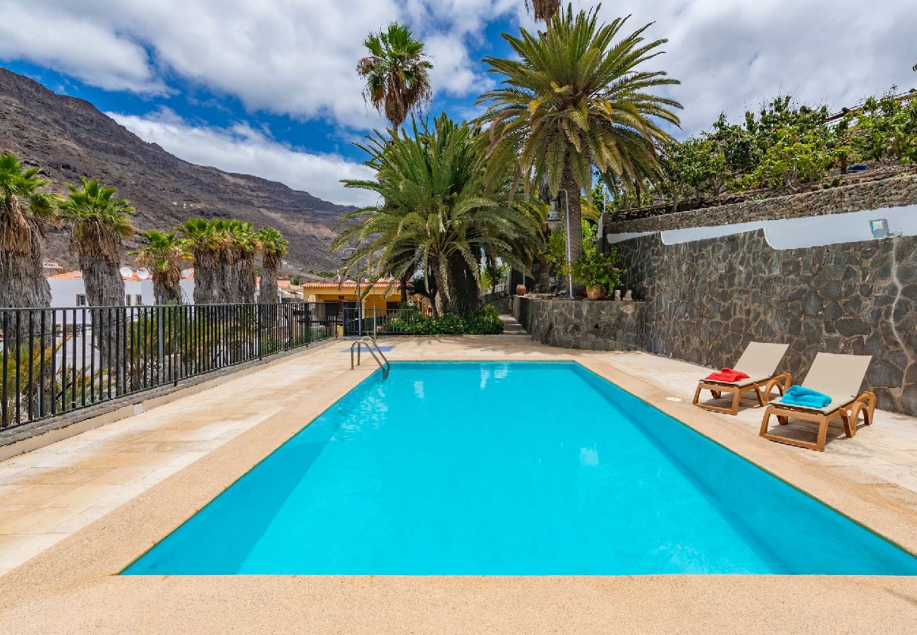 Huis in Mogán - GC0284 Vakantiehuis met gedeeld zwembad in Mogán